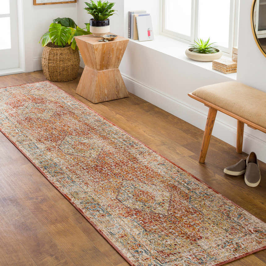 Hallway with Candiis Luxe Performance Rug runner in brick red, cream, and blue. Bohemian style with wood bench and plants. Roomscene-Runner