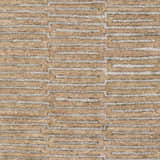 Close-up of the Colona Area Carpet. Brown rug with a contemporary geometric pattern in pale blue and dark red. Swatch