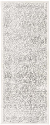 Close-up of the Comstock Area Rug. Machine-woven rug in charcoal, medium gray, off-white, and white gray. Bohemian style. Design-Runner-2710