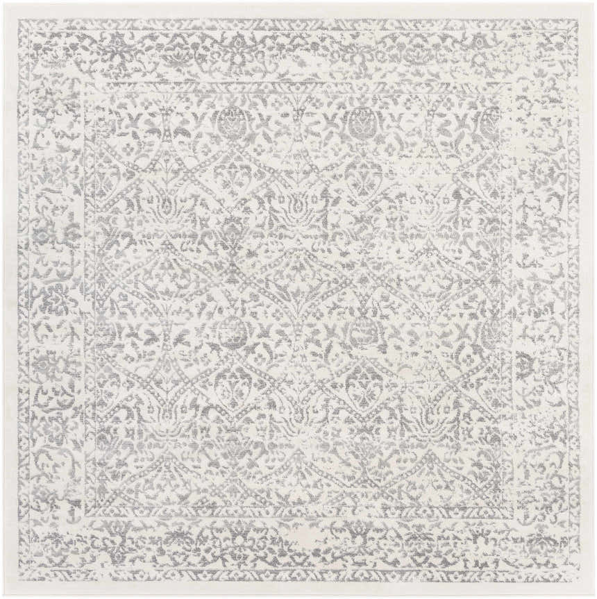 Close-up of the Comstock Area Rug. Machine-woven polypropylene rug in charcoal, gray, and off-white with a traditional pattern. Design-Square-67