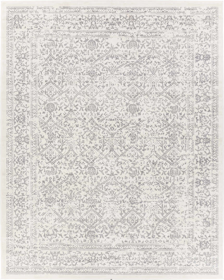 Close-up of the Comstock Area Rug. Bohemian style rug in charcoal, gray, and off-white with a traditional floral pattern. Design-Rectangle-71010