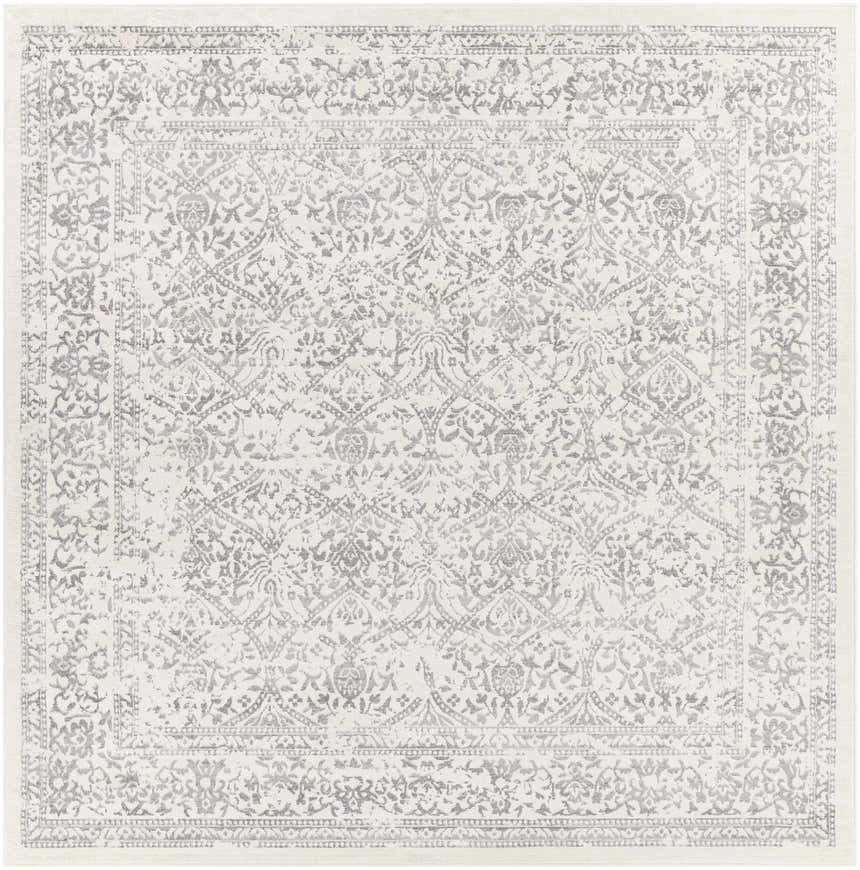 Close-up of the Comstock Area Rug, a machine-woven rug with a traditional gray and off-white floral pattern. Design-Square-710