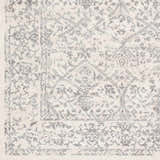 Close up of the Comstock Area Rug showing its charcoal and off white traditional pattern. Swatch