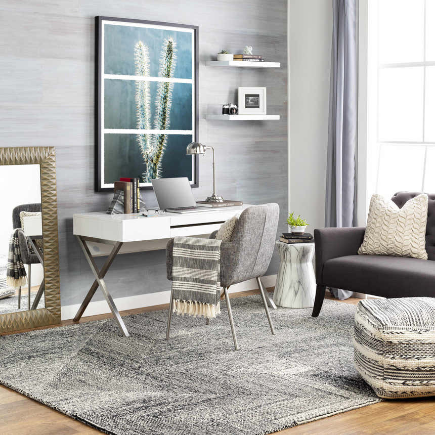 Contemporary home office with cream and black Conshohocken Area Rug, white desk, gray chair, and modern decor. Roomscene-Rectangle