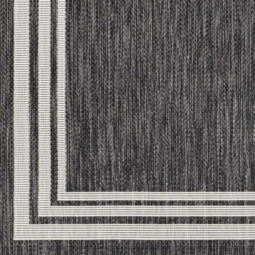 Close-up of the Coonamble Bordered Antrasit Rug, featuring a charcoal base and cream striped border. Swatch