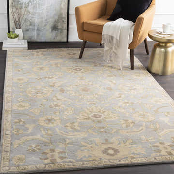 Living room scene with Copen Beige Floral Wool Rug, mustard chair, gold side table, and dark wood floors. Roomscene-Rectangle