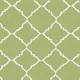 Close-up of the Creekside Area Rug showing its green and white geometric trellis pattern. Hand woven wool texture. Swatch