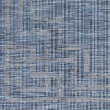 Close-up of the Corlette Area Rug. Machine woven texture with a contemporary blue and gray geometric pattern. Swatch