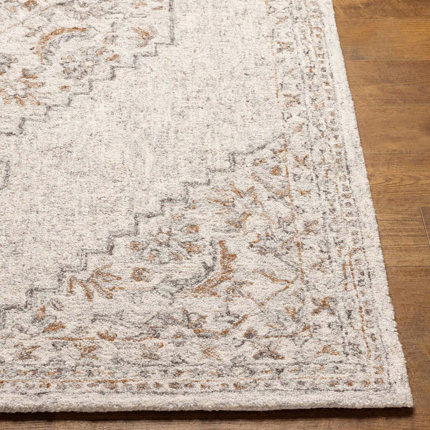 Close-up of the Currimao Area Carpet showing its traditional Persian design, soft ivory tones, and hand-tufted texture. Front