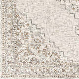 Close-up of the Currimao Area Carpet showing its farmhouse design, floral pattern, and neutral colors. Swatch