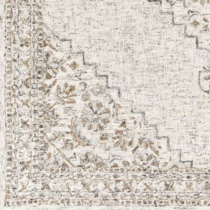Close-up of the Currimao Area Carpet showing its farmhouse design, floral pattern, and neutral colors. Swatch