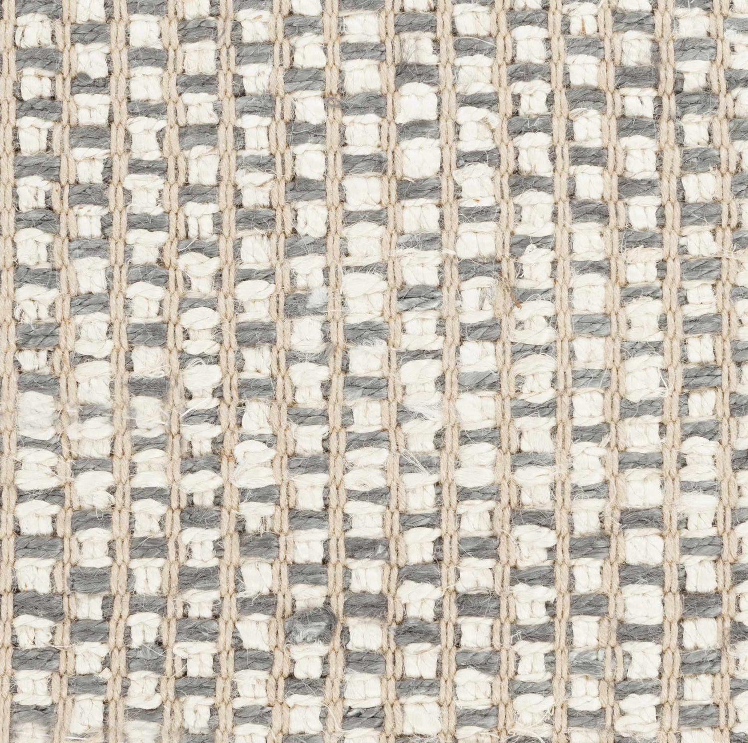 Close-up of the Carrier Clearance Jute Carpet showing its woven texture in charcoal, ivory, and natural jute. Texture