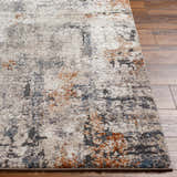 Close up of a Cashi Thick Luxe Rug showing the clay, mocha, and off-white abstract pattern and textured pile. Front