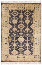 Close-up of the hand-knotted Castlewood Area Rug. Features black, burnt orange, light olive, and medium brown tones. Design-Rectangle-23