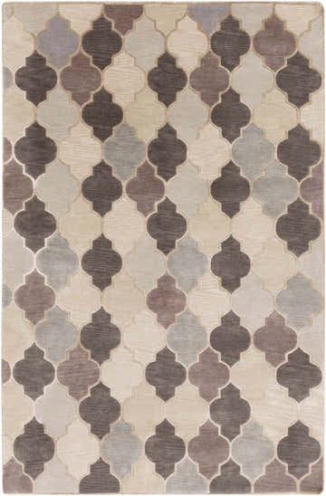 Close-up of the hand-knotted Cuero Area Rug. Features a quatrefoil pattern in charcoal, light brown, and taupe hues. Design-Rectangle-58
