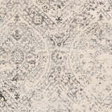 Close-up of the Cundiff Area Rug, a machine-woven rug with a traditional beige, black, and gray pattern. Swatch