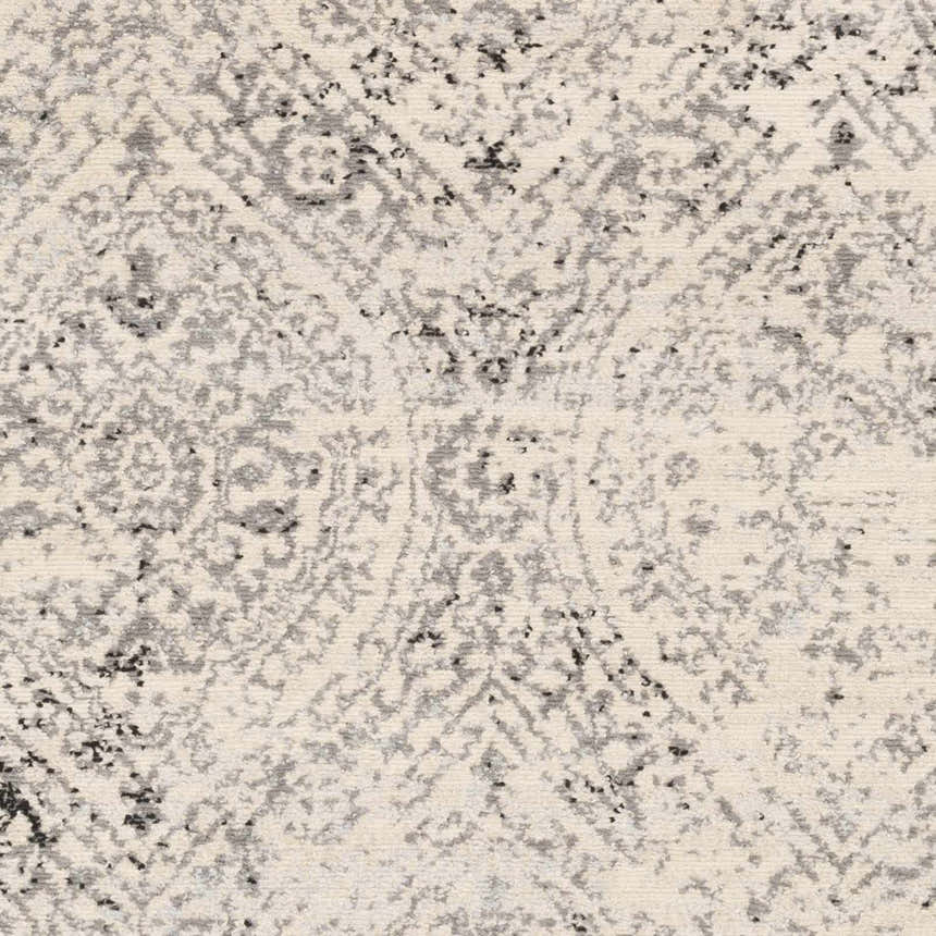 Close-up of the Cundiff Area Rug, a machine-woven rug with a traditional beige, black, and gray pattern. Swatch