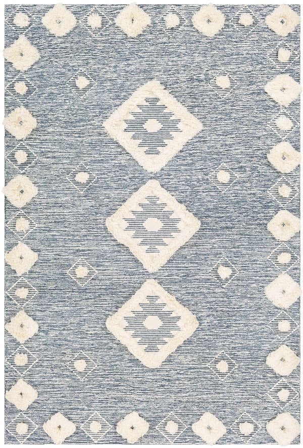 Close-up of the Curllsville Area Rug. Cream wool diamonds on a navy blue, hand-tufted, farmhouse-style rug. Design-Rectangle-576