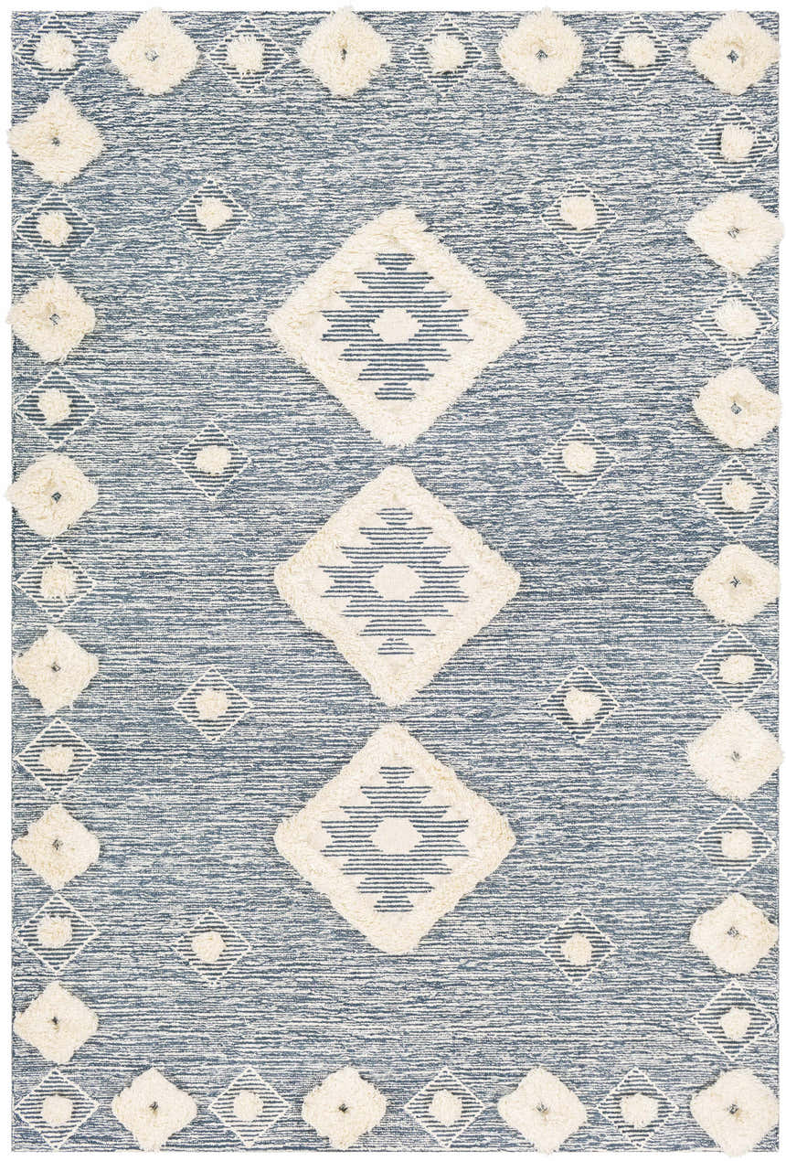 Close-up of the Curllsville Area Rug. Cream wool diamonds on a navy blue, hand-tufted, farmhouse-style rug. Design-Rectangle-576