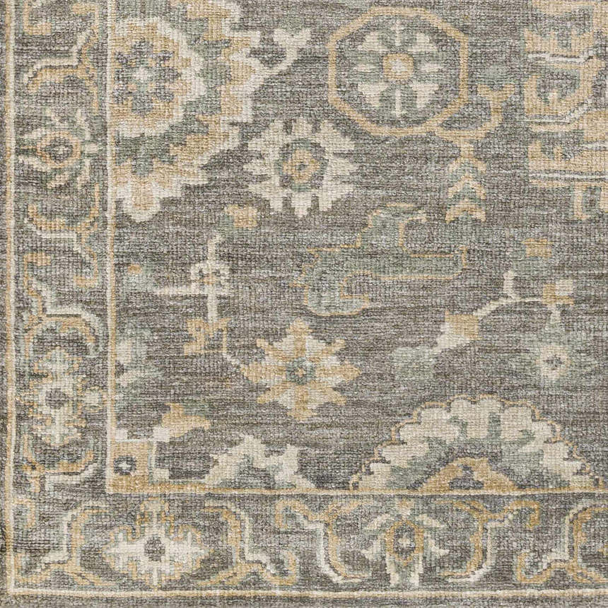 Close-up of the Dallas Area Rug, showcasing its charcoal, sage, and beige traditional floral pattern and hand-knotted texture. Swatch