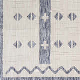 Close-up of the Dapitan Indoor & Outdoor Rug showing a geometric pattern in dark gray and denim. Swatch