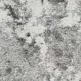 Close-up of the plush Dawesville Gray White Shag Area Rug showing its soft, textured pile and abstract gray and white pattern. Swatch