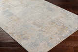 Close-up of the Deka Deep Teal Thick Luxe Rug showing its teal, gray, and brown contemporary pattern and soft texture. Corner