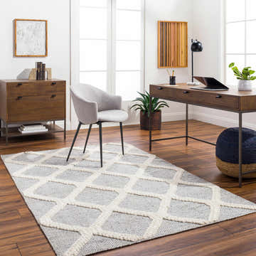 Home office with Della Area Rug in gray and white geometric design, wood desk, and modern chair. Roomscene-Rectangle