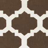 Close up of the Depew Area Rug, a hand woven wool rug with a dark brown and ivory geometric pattern. Swatch