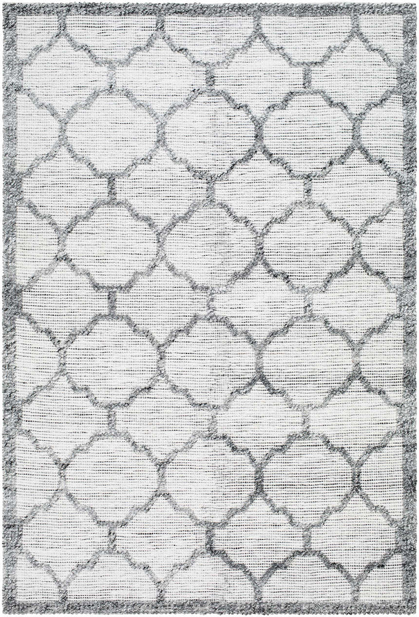 Close-up of the hand woven Dido Area Rug in charcoal and gray with a traditional quatrefoil pattern. Design-Rectangle-576