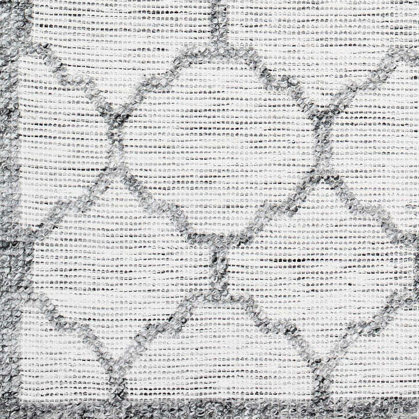 Close-up of the hand woven Dido Area Rug. Charcoal, gray, and pewter geometric pattern on a white background. Swatch