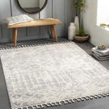 Entryway with cream and gray Dolo Area Rug, wood bench, round mirror, and neutral decor. Roomscene-Rectangle