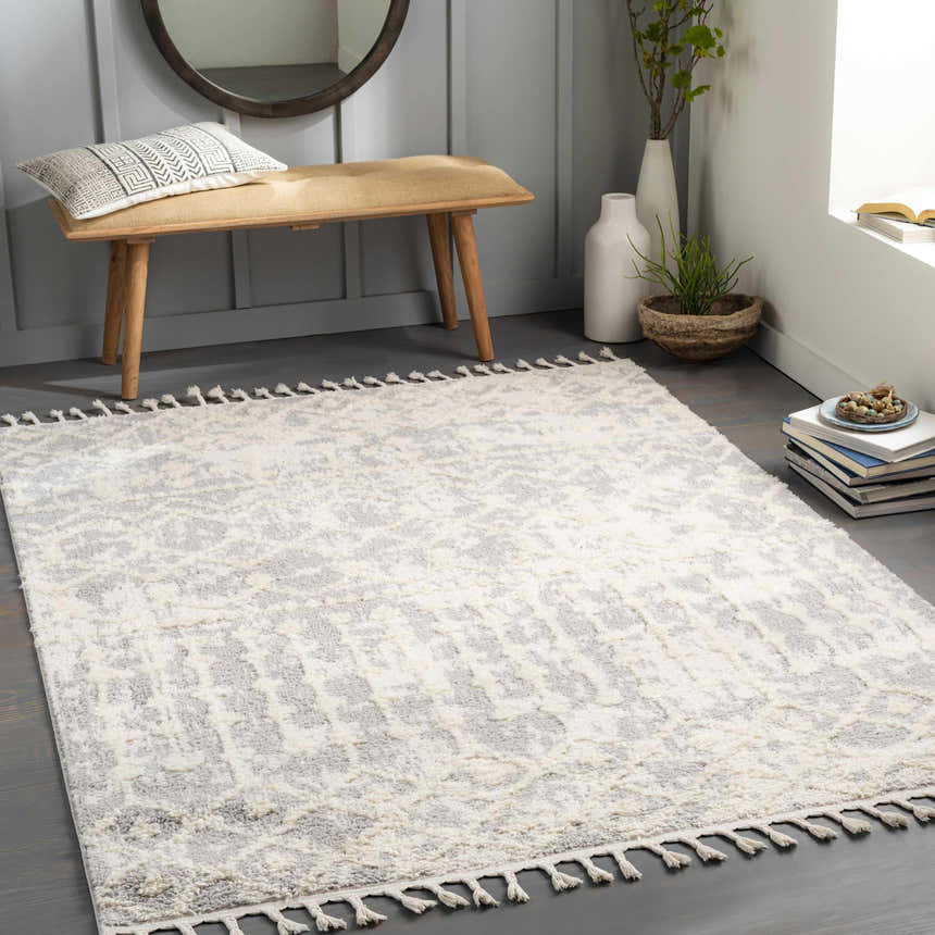 Entryway with cream and gray Dolo Area Rug, wood bench, round mirror, and neutral decor. Roomscene-Rectangle