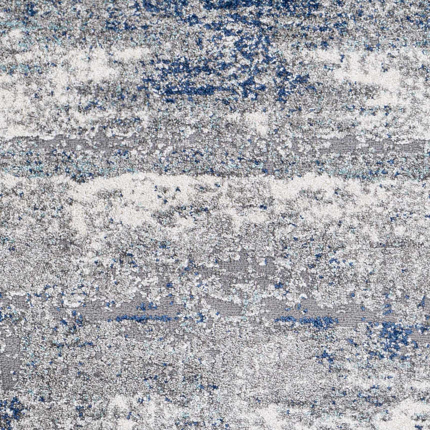 Close-up of Jeju Thick Abstract Area Rug showing texture, and colors: aqua, charcoal, dark blue, gray, navy, and off white. Swatch
