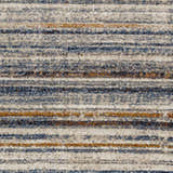 Close up of the Dumaguil Thick Luxe Rug showing its blue, brown, and cream horizontal stripe pattern and textured weave. Swatch