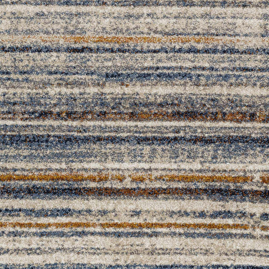 Close up of the Dumaguil Thick Luxe Rug showing its blue, brown, and cream horizontal stripe pattern and textured weave. Swatch