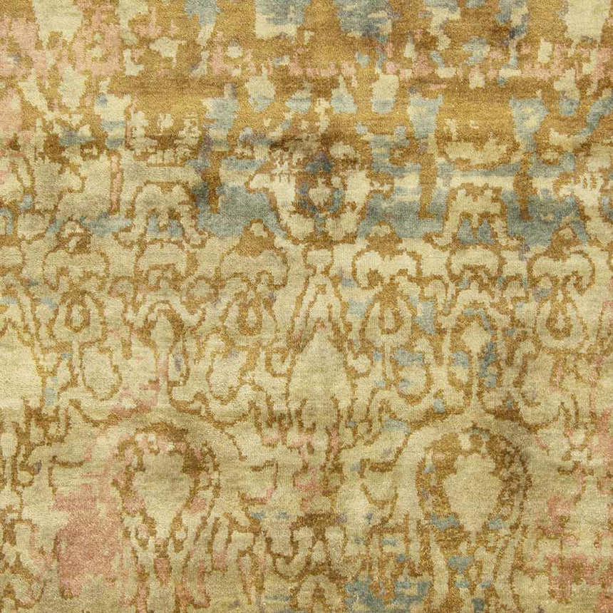 Close-up of the Duncansville Area Rug. Hand-knotted wool rug in aqua, brick red, dusty pink, and light brown. Traditional style pattern. Swatch