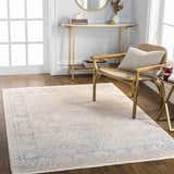Entryway with Dian Area Rug in dark blue, ivory, and light blue, styled with gold console table and chair on wood floor. Roomscene-Rectangle