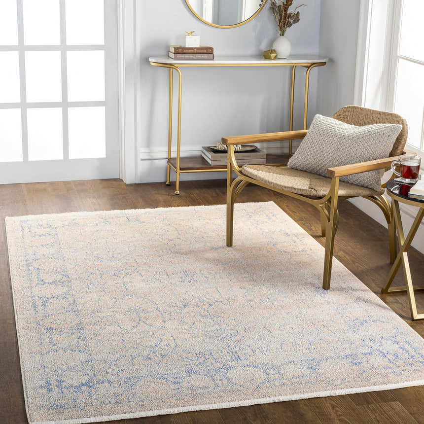 Entryway with Dian Area Rug in dark blue, ivory, and light blue, styled with gold console table and chair on wood floor. Roomscene-Rectangle