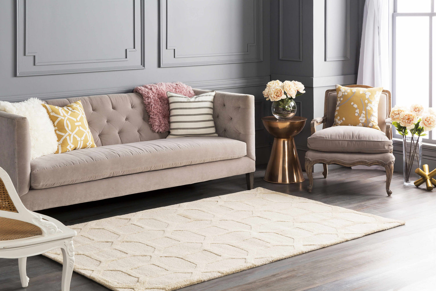 Living room scene with a beige sofa and the beige Dodgertown Area Rug with a geometric pattern. Roomscene-Rectangle