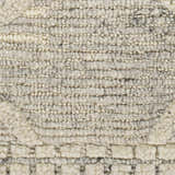 Close-up of the Donsol Area Carpet, a hand-woven wool rug with a textured, looped pile in cream, gray, and charcoal hues. Swatch