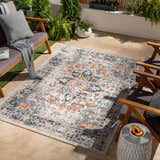 Outdoor patio scene with the Dorval Traditional Rug, gray chairs, and potted plants. Roomscene-Rectangle