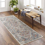 Entryway with Dorval Traditional Rug runner in brick red, cream, and denim. Bench with books and plants. Roomscene-Runner