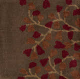 Close-up of the Dovercourt Clearance Rug showing the wool texture and brick red, dark red, and mustard leaf pattern. Swatch