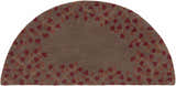 Close-up of the Hearth-shaped Dovercourt Clearance Rug. Features a leaf pattern in brick red and mustard on a dark brown wool. Design-Hearth