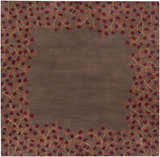 Close-up of the Dovercourt Clearance Rug; a hand-tufted wool rug with a brick red and dark red leaf pattern on a dark brown background. Design-Square-6