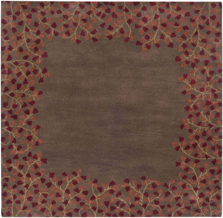 Close-up of the Dovercourt Clearance Rug; a hand-tufted wool rug with a brick red and dark red leaf pattern on a dark brown background. Design-Square-6