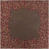 Close-up of the Dovercourt Clearance Rug. Brown wool rug with a brick red and mustard leaf pattern border. Design-Square-8