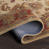 Close-up of the hand-tufted Cherryfield Brown & Rust 1001 Wool Rug showing its traditional floral pattern and wool texture. Fold