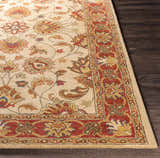 Close-up of the hand-tufted Cherryfield Brown & Rust 1001 Wool Rug. Features a traditional floral pattern with brick red and tan colors. Front